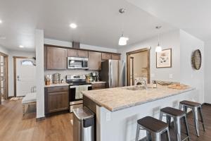 a kitchen with wooden cabinets and a counter top at Destiny Cove in Kalispell