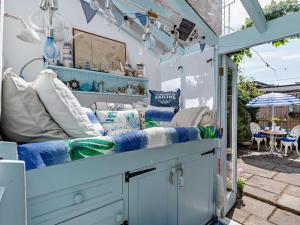 a pergola with a bench in a patio at 1 Bed in Lymington oc-94751 in Lymington
