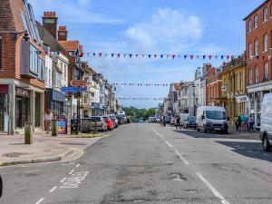 an empty street in a town with cars parked at 1 Bed in Lymington oc-94751 in Lymington