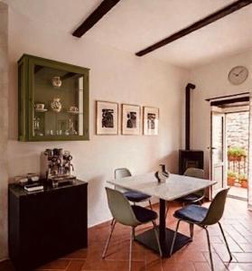 a dining room with a table and chairs at Casa Amiata 2 in Montelaterone +30 photos