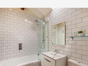 a white bathroom with a sink and a shower at 2 Bed in Lancaster oc-91411 in Clapham +12 photos
