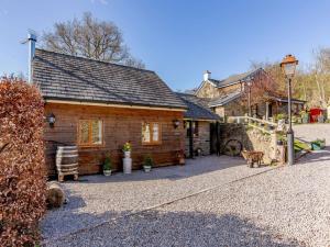 a log cabin with a porch and a street light at 1 Bed in Lydney oc-43724 in Lydney