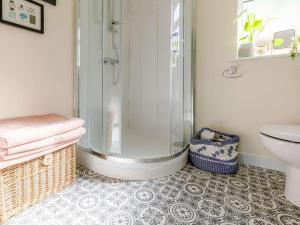 a bathroom with a shower and a toilet and a sink at 2 Bed in Ashbourne oc-81345 in Clifton +15 photos