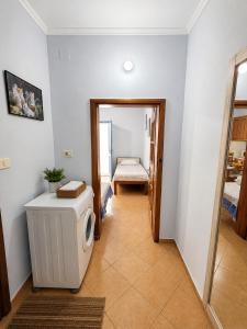 a room with a heater and a door to a bedroom at Garden Oasis in Vlore in Vlorë