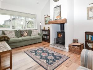 a living room with a couch and a fireplace at 1 Bed in Carnforth oc-90554 in Middleton