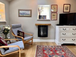 a living room with a tv and a fireplace at 1 Bed in Riding Mill oc-cn063 in Corbridge