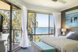 
a hotel room with a view of the ocean at Anne's Waterfront Haven B&B in Corlette
