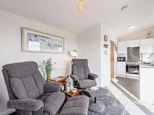 a living room with two chairs and a couch at 1 Bed in Weymouth oc-82099 in Osmington