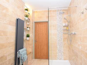 a shower with a glass door in a bathroom at 1 Bed in Lymington oc-50723 in Sway +5 photos