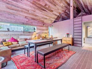 a living room with a table and a couch at 2 Bed in Lymington oc-95021 in Brockenhurst