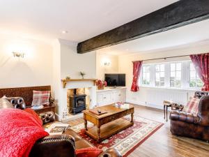 a living room with a couch and a table at 1 Bed in Sheffield oc-48259 in Thurlstone