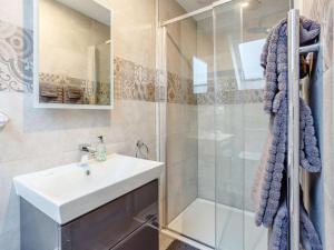 a bathroom with a sink and a shower at 2 Bed in Lairg oc-86104 in Durness +9 photos