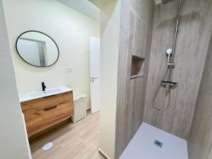 a bathroom with a sink and a mirror at Casa Solano in Tías