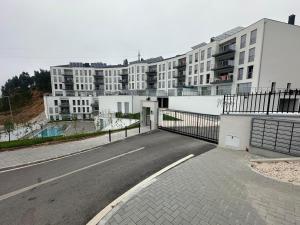an empty street in front of a building at Apartamento B T4 Pombal in Pombal