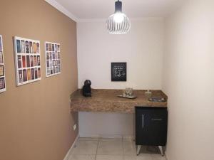a kitchen with a counter in a room at Casa da Ópera in Diamantina +10 photos