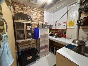 a kitchen with a counter and a sink in it at MG 5pax 1 AC BR 300mbps FREE Netflix Parking Cignal Videoke Shower Heater Cook & Grill in Rodriguez
