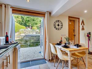 a kitchen with a table and chairs and a large window at 2 Bed in Kelsall oc-94445 in Kelsall