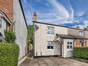 an old brick house with a white at 2 Bed in Kelsall oc-94445 in Kelsall