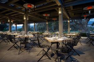 a group of tables and chairs on a patio at Ojai Valley Inn in Ojai