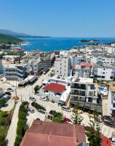 an aerial view of a city with buildings and the ocean at Garden Villa Veli in Ksamil