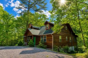 a house in the woods with a gravel driveway at Laurel Cottage, 560 FREE tickets each paid day, Hot Tub, Pool Table! in Sevierville