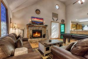 a living room with couches and a pool table at Laurel Cottage, 560 FREE tickets each paid day, Hot Tub, Pool Table! in Sevierville