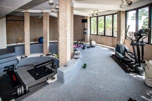 a room with a gym with a treadmill and exercise equipment at Indoor/Outdoor Pools!! Hot Tub! Steam Room! Sauna! in Osage Beach