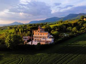 an aerial view of a large house in a field at Relais Villa Flora Berta in Matelica