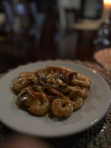 a plate of onion rings on a table at Hotel Boutique Casa Bonanza in Guamal +23 photos