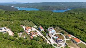 an aerial view of a house in the middle of a forest at Holiday house Casa Vida in Rakalj