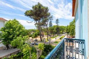 a balcony with a view of a park at Salt&Flow in Parede