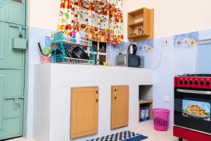 a toy kitchen with a play kitchen at Almarg homes in Nakuru