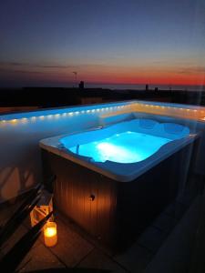 a jacuzzi tub on the roof of a building at Il Portico Rosa in Cuglieri