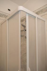 a shower with a glass door in a bathroom at Natura e Relax Casa Emma in Buonvicino +18 photos