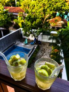 two glasses of drinks sitting on a table at AZORA Boutique Studios in Ahangama