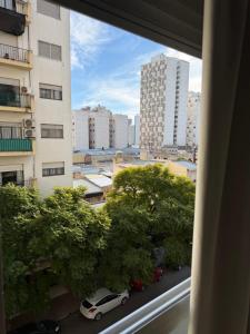 a view of a city from a window of a building at Depto Céntrico cq in Bahía Blanca