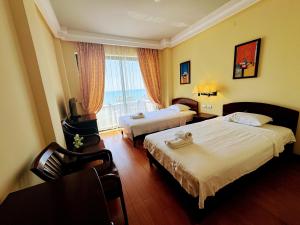 Un pat sau paturi într-o cameră la Vela Hotel Restaurant +21 fotografii