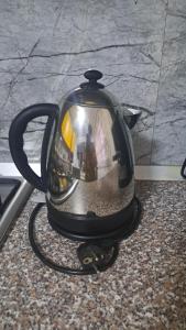a tea kettle sitting on top of a counter at CASA ROTARU in 2 Mai