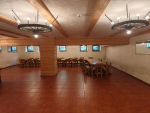 a large room with tables and chairs in it at Brižių sodyba in Brižiai