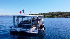 a group of people sitting on a boat in the water at Aquaïa, Saint-Tropez by sea in Cogolin +7 photos