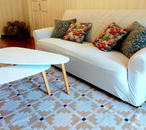 a living room with a couch and a table at El Café I in Nava