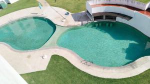 an overhead view of a large swimming pool at Habibi Cocoyoc in Cocoyoc