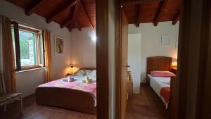 a small bedroom with two beds and a window at Villa Olive in Dol +12 photos