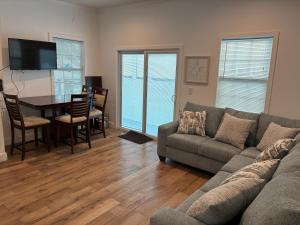 a living room with a couch and a table at Island Paradise in Key West
