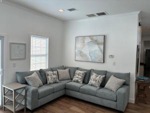 a living room with a gray couch in a room at Island Paradise in Key West