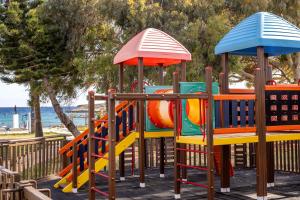 a playground with a colorful play equipment at Electra Beach Holiday Village in Ayia Napa