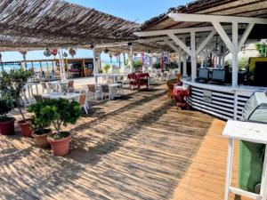 Un restaurant sau alt loc unde se poate mânca la Vela Hotel Restaurant