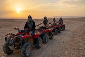 a group of people riding atvs in the desert at Luxor Star ATV in Luxor