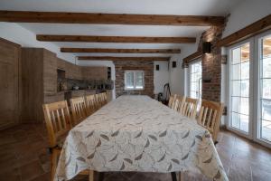 a large dining room with a table and chairs at Mazury Villa Ecomfort in Szeligi