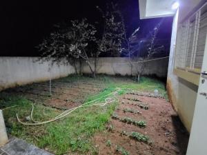 a garden at night with a garden hose at عين السلطان ain sultan in Imouzzer du Kandar +2 photos